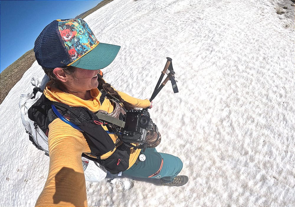 outdoor vitals CS40 Ultra Backpack being worn by a hiker on a snowfield in the alpine of the rocky mountains in southwest colorado