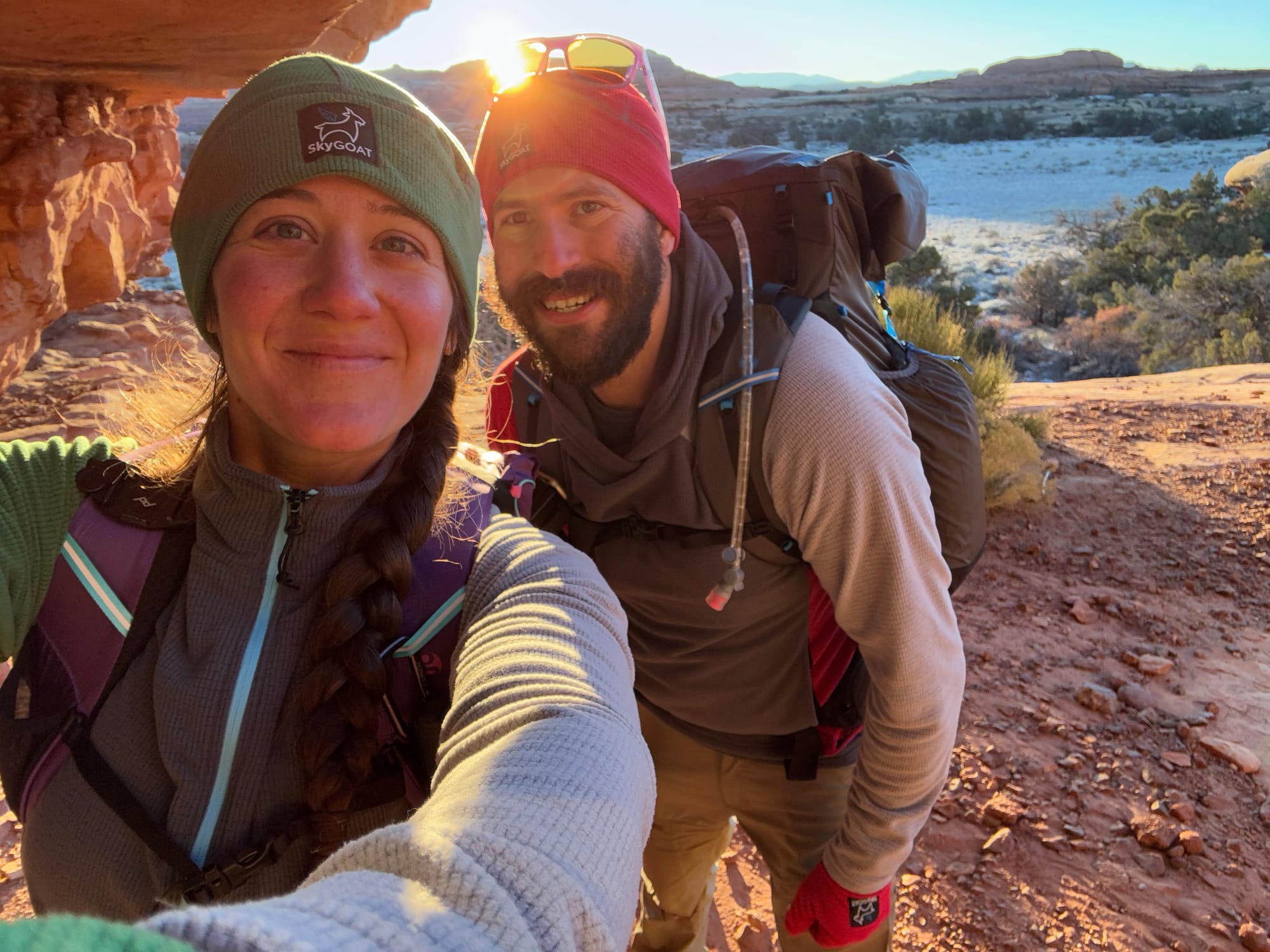 backpackers wearing skygoat grid fleece camp jacket on a freezing cold morning hike