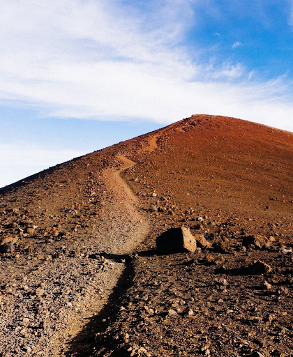 a mountainscape of a high peak