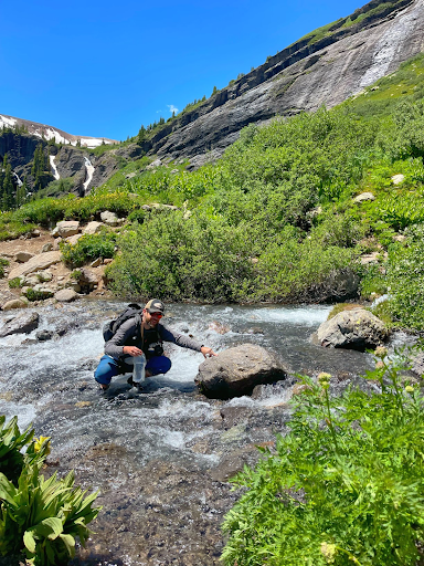 a man filtering his water on his first southwest hike