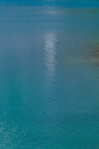 neon blue water in ice lake basin