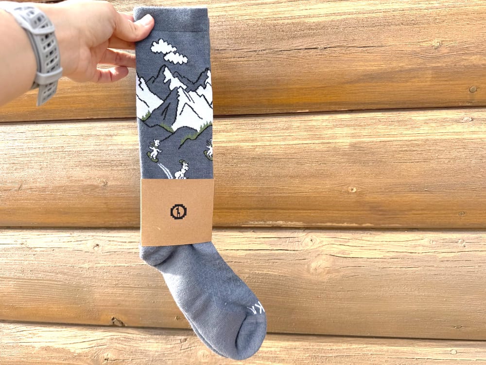 paka sebastian ski socks alpaca wool socks in packaging with outdoor light