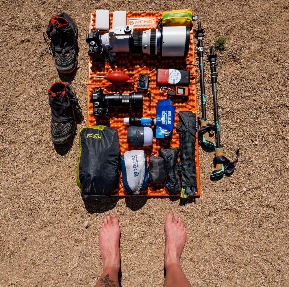 a flat lay of backpacking gear for the sky island traverse