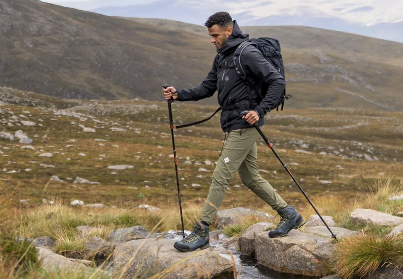 a hiker using trekking poles