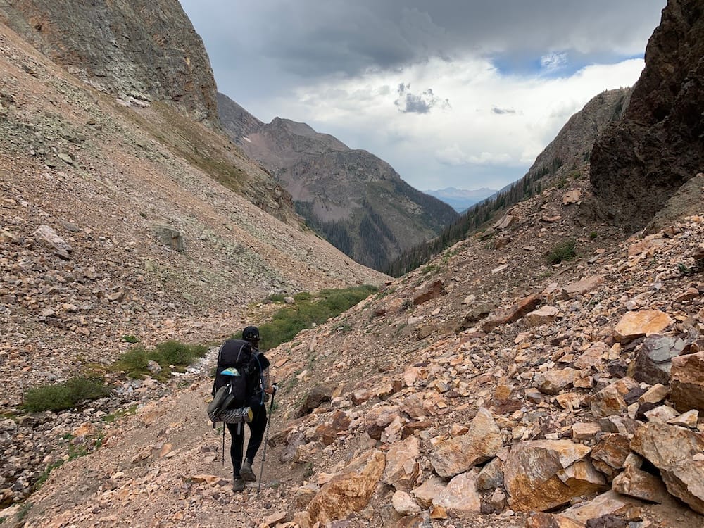 using trekking poles on a scree slope