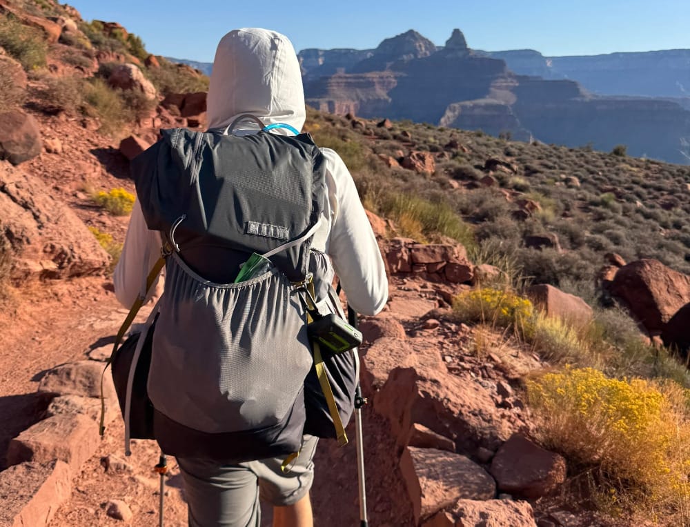 a backpacker wearing an ultralight gossamer gear backpack while venturing into the grand canyon on a big adventure