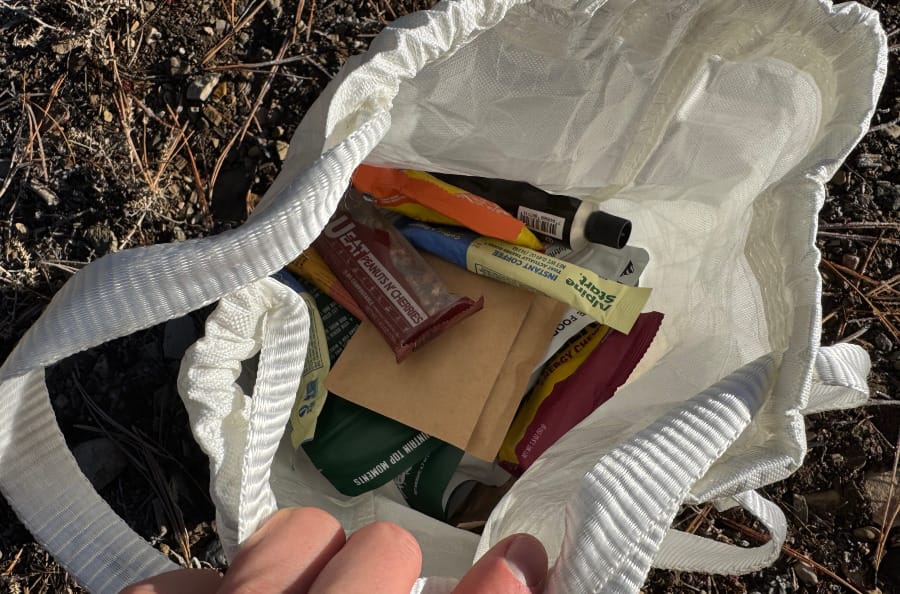 grizzly bear resistant ultralight food locker holding over one week's worth of food for a backpacking trip in canyonlands