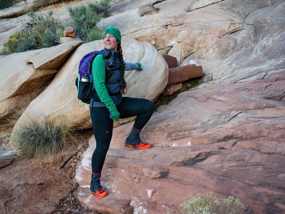 a backpacker wearing gossamer gear's kumo 36 superlight backpack begins a steep climb in the southwest