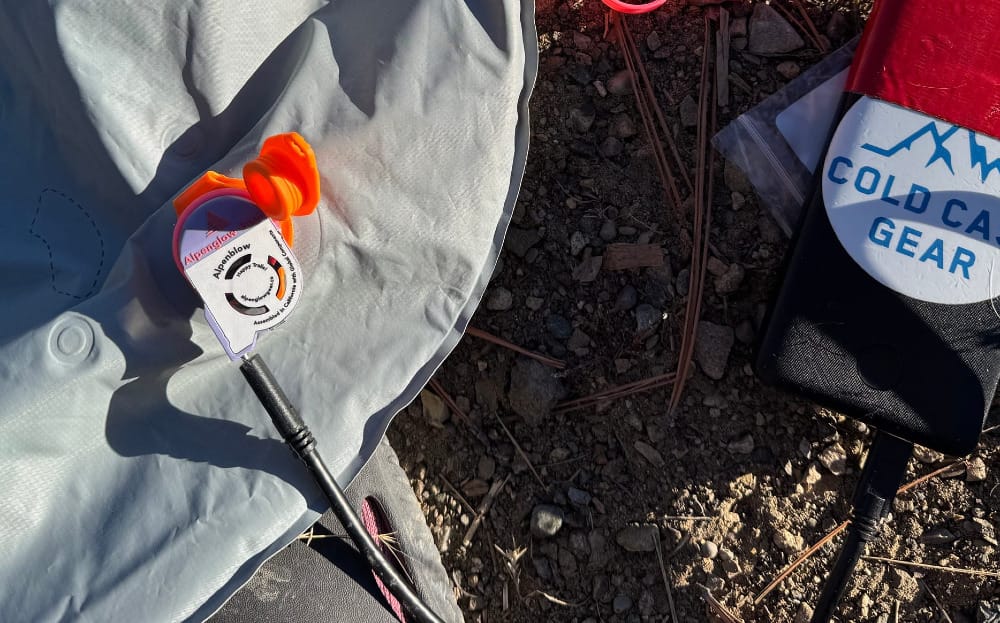 Alpenblow Micro Inflator By Alpenglow Gear in use during a camping trip