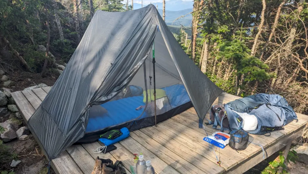 one our picks for the best ultralight solo backpacking tents on the market pitched on a small camp site