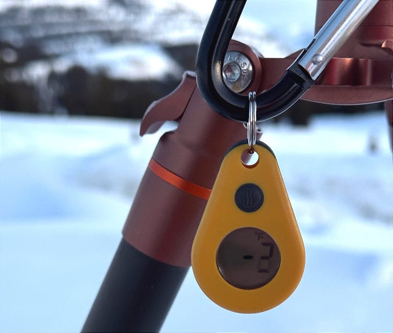 The Gear Review: Zipper-Pull Thermometer by ThermoWorks on the leg of a tripod in the frigid winter.