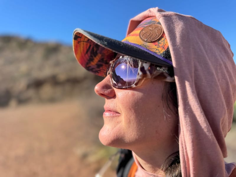 a hiker shows the wide temples on the Piedra Sunglasses By Bajio