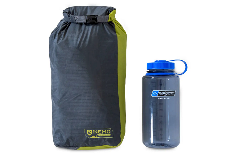 a size comparison of the Hornet OSMO Ultralight Backpacking Tent By NEMO Equipment next to a nalgene bottle