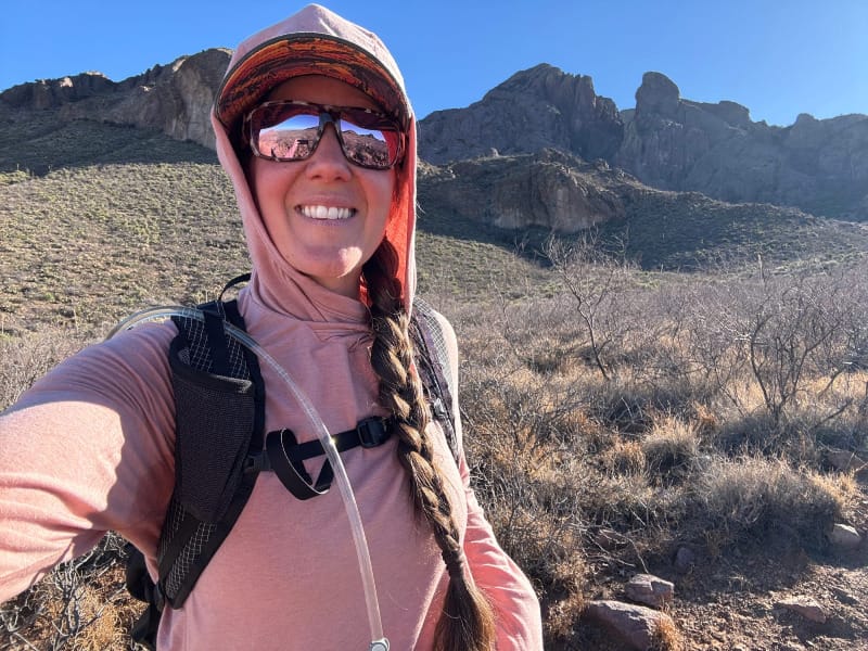 A hiker wears the piedra sunglasses from bajio in the mountains of the desert