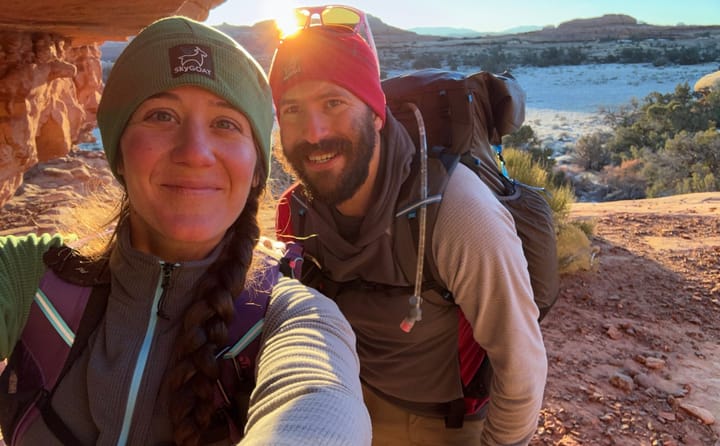 two hikers on a backpacking trip in grid fleece hoodies they picked up during the 2024 holiday sales