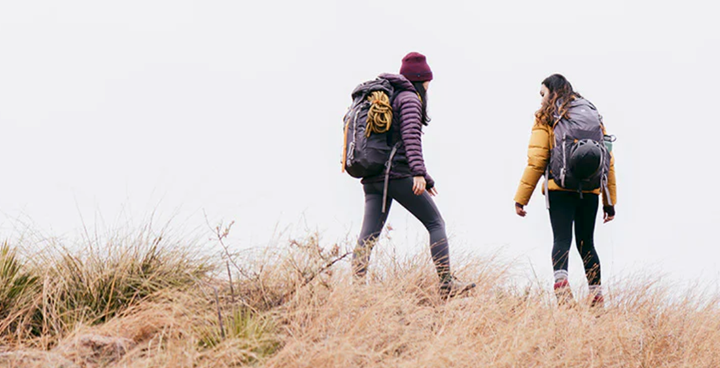 two women with ultralight backpacks hiking