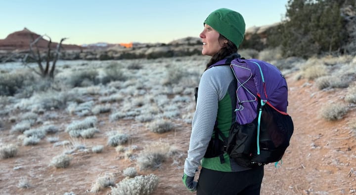 a hiker wearing the Kumo 36 Superlight Backpack by Gossamer Gear on a chilly morning in the high desert of the southwest