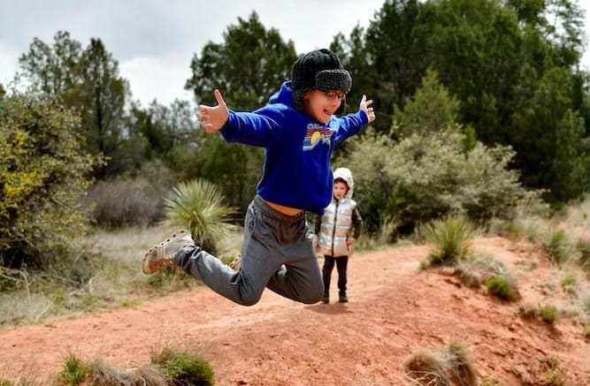 a child leaps in joy knowing he is a future steward of the southwest