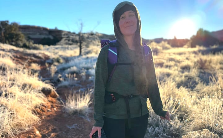 the hoodie by paka being worn by an adventure backpacker on a hike in the southwest