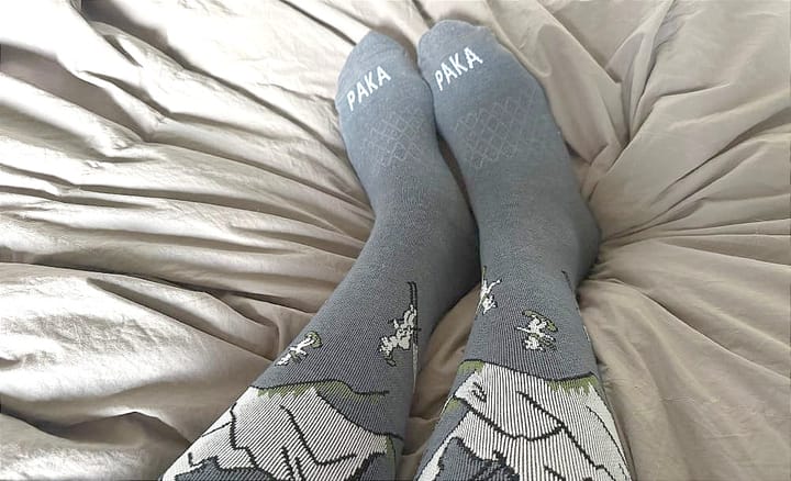 paka sebastian ski socks being worn to get cozy on a cold day