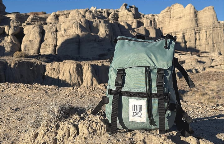 the TOPO Deisgns rover mini backpack sitting in a high desert landscape of the southwest during a hike