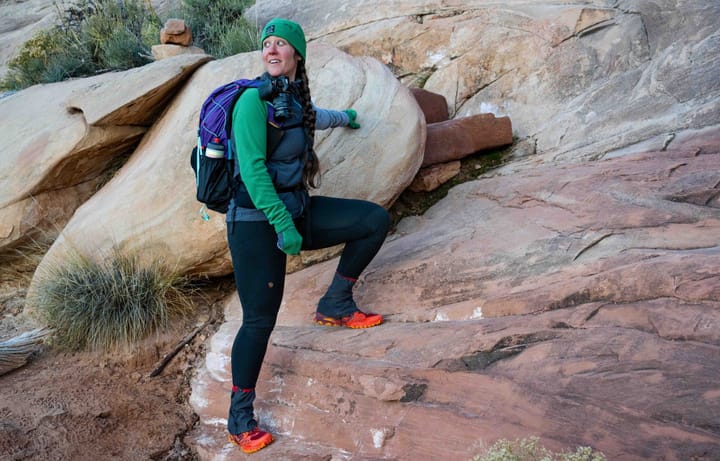 a backpacker on a hike wearing the skyGOAT grid fleece camp jacket in the southwest on a cold morning