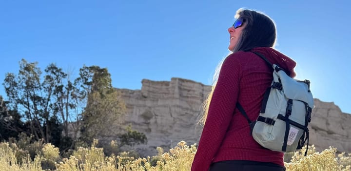 a hiker wears a topo designs rover backpack to celebrate the savings during the Last Chance Sale for 30% off Sitewide